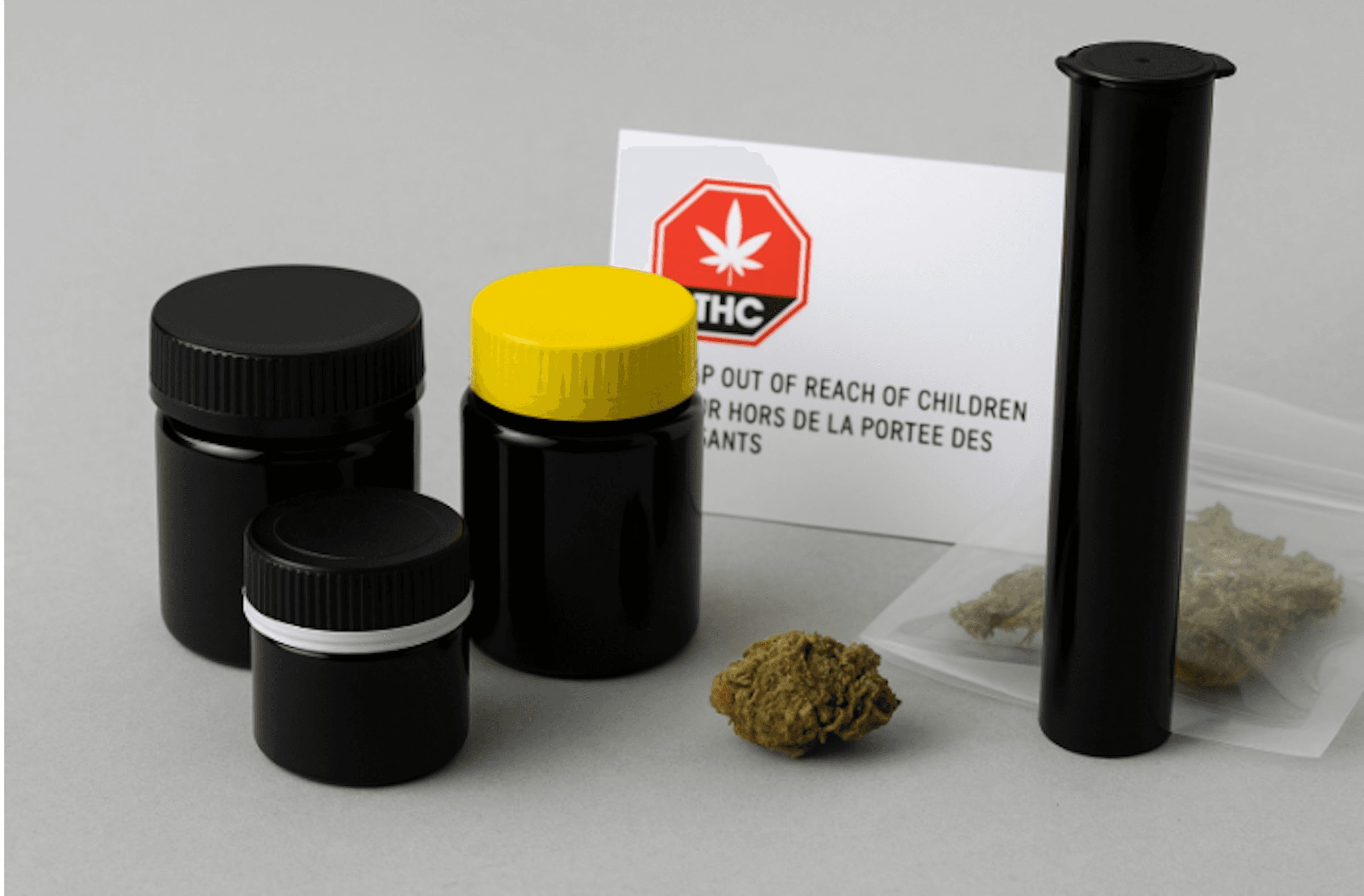 Child-resistant cannabis packaging in Canada including black PET jars, pop-top tube, and resealable mylar bag with Health Canada warning label.