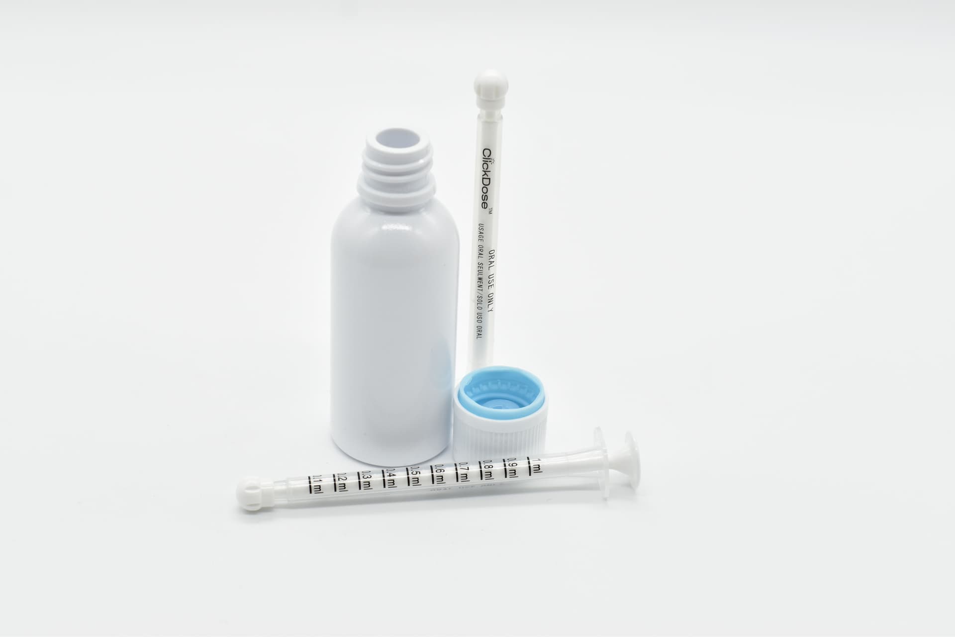 MedLock’s high-precision ClickDose syringes displayed with child-resistant bottles and caps, designed for safe and accurate dispensing of high-THC oils