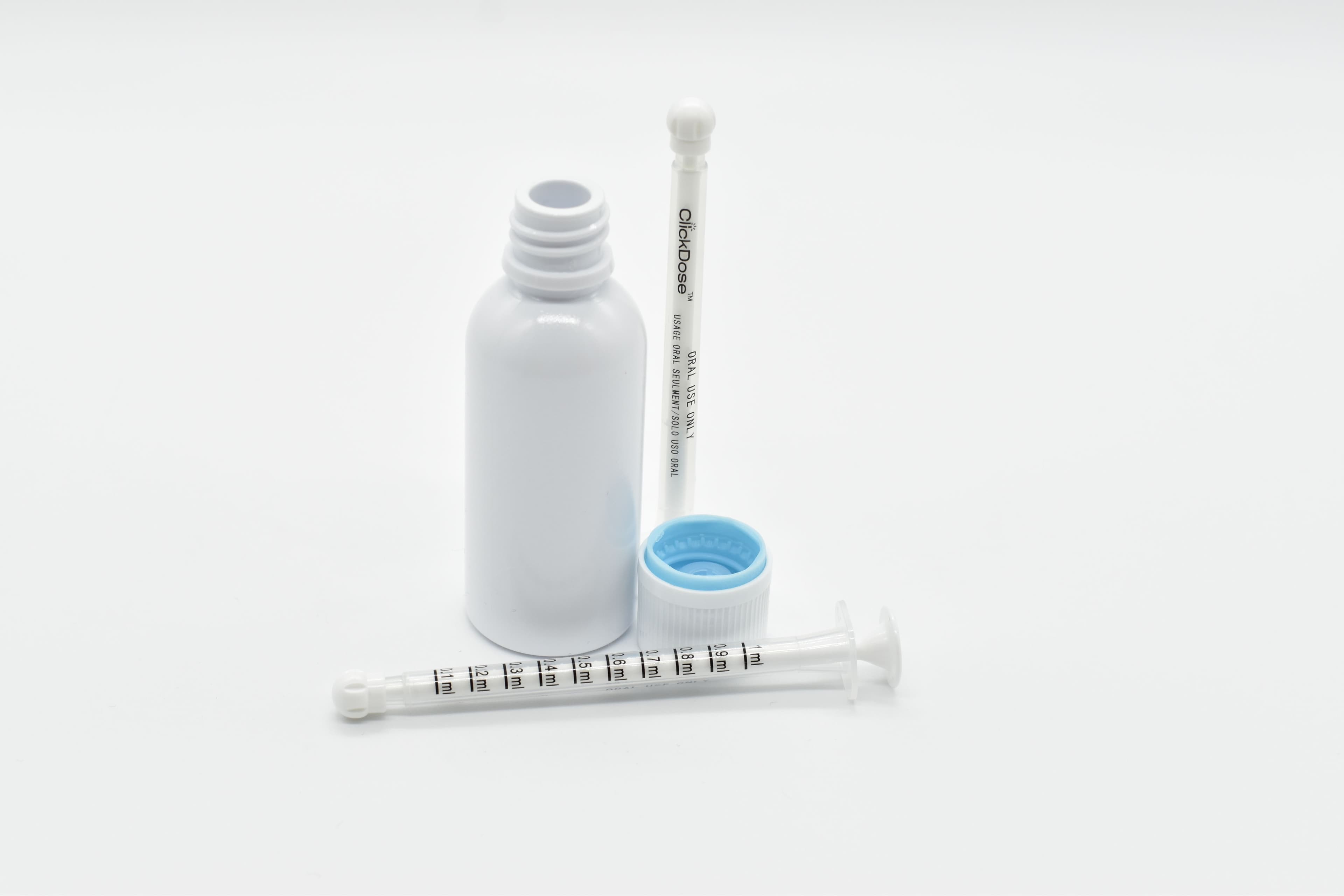 MedLock’s high-precision ClickDose syringes displayed with child-resistant bottles and caps, designed for safe and accurate dispensing of high-THC oils